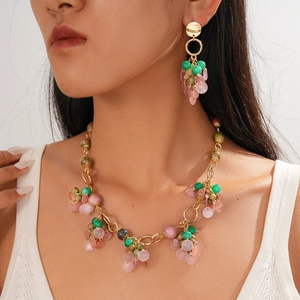 Bohemian jewelry set with stone beads and geometric pendants on a model