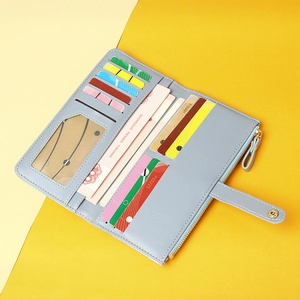 Long light blue wallet for women with multiple card slots and internal zipper pocket