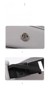 Detail of adjustable elastic strap and silver H metal buckle on sun visor hat