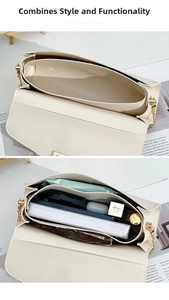 Detail view of multi-compartment interior for cream leather bag showing large capacity