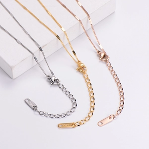 Detailed view of 18KGP titanium steel necklaces in silver, gold, and rose gold finishes