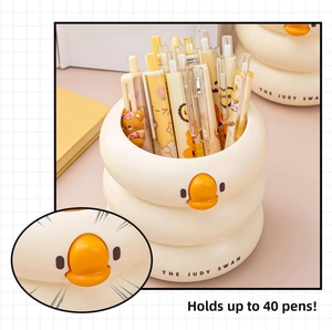 Detail of cream swan pencil holder with large capacity storing 40 pens and cute face
