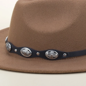 Detail of brown fedora hat with black leatherette belt featuring embossed silver studs