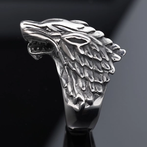 Macro view of vintage wolf head ring detailing intricate fur textures and dark metal finish