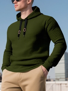 Detail shot of men's dark green hoodie with waffle texture and adjustable drawstring hood