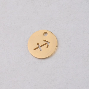Macro shot of 12mm gold Sagittarius zodiac charm with high-polished mirror finish
