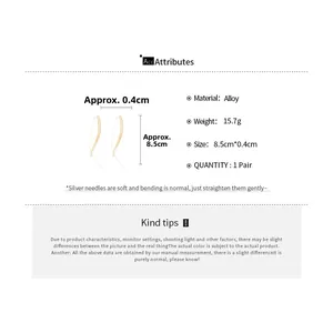 Detailed view of long gold wavy drop earrings with alloy material and silver needle specs