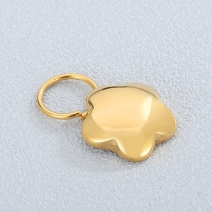 Polished gold flower star pendant with a circular ring connector in stainless steel