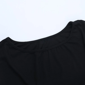 Detailed view of the round neckline on a black knitted off-shoulder lace splicing T-shirt