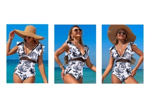 Detail view of one-piece swimsuit with tropical leaf print and black mesh cutouts