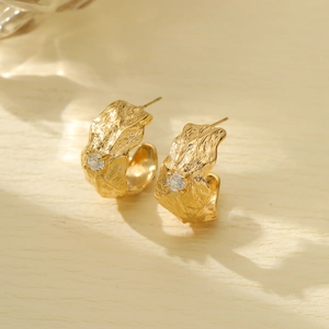 Textured gold-plated titanium steel earrings with round sparkling crystals