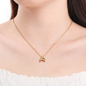 Golden stainless steel necklace featuring a textured whale tail pendant on a minimalist chain