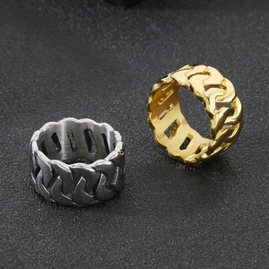 Macro shot of 18k gold and silver stainless steel Cuban link chain rings for men