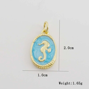Detail of 2.0cm gold seahorse pendant with blue enamel inlay and zircon accents