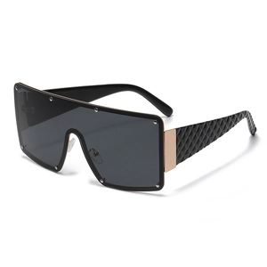 Fashion oversized one-piece sunglasses with black lenses and gold textured temples