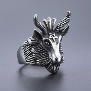 Macro detail of vintage stainless steel ram head ring with pentagram carving