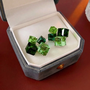 Silver needle green square crystal stud earrings in a luxury octagonal velvet jewelry box
