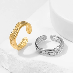 Minimalist irregular pleated open rings in gold and silver finish on stone base