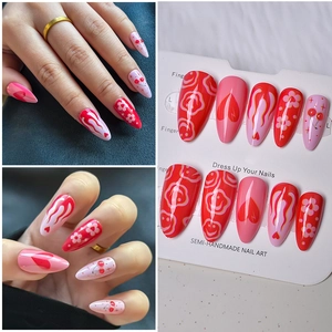 Semi-handmade Y2K almond press-on nails featuring red heart and cherry patterns