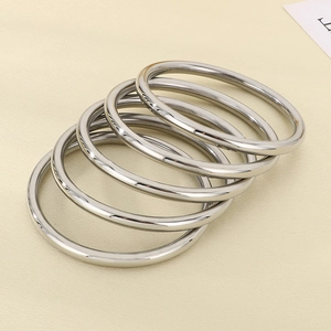 Macro view of 5-piece set high-polished 6mm silver stainless steel bangles