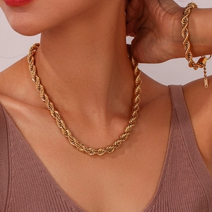 Close-up of 18K gold-plated stainless steel rope chain necklace and bracelet on model