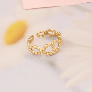 Detailed view of the gold beaded chain link ring with adjustable open band design