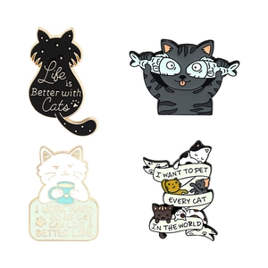 Set of four cute cat enamel pins with motivational quotes and artistic feline designs