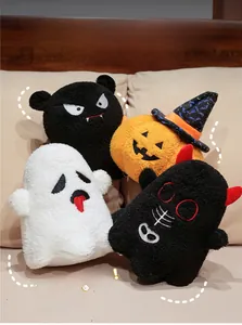 Detail of Halloween plush collection with pumpkin and ghost dolls on a soft cushion