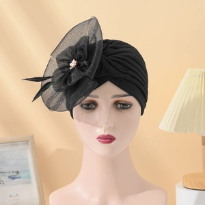 Elegant black turban hat with large mesh flower, feather and pearl accent decorations