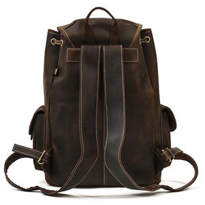 Detailed back view of vintage brown crazy horse leather backpack with wide straps
