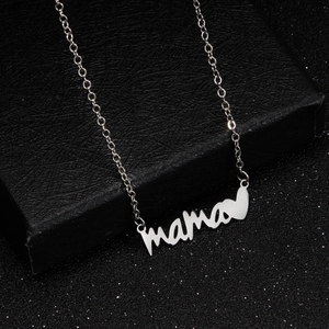 Detail of silver Mama pendant with heart on black gift box, stainless steel necklace