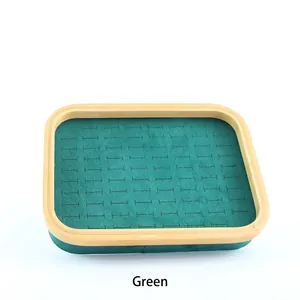 Bamboo wood jewelry display tray with green microfiber velvet slots for rings and earrings