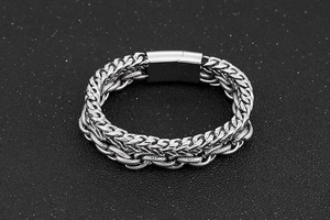 Close-up of silver stainless steel double-layered keel and curb chain bracelet for men