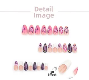 Detail of almond fake nails with 3D floral patterns, purple leopard print and gold beads