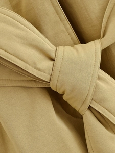 Detail of khaki twill cotton coat featuring a waist belt with high quality stitching