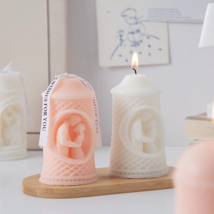 Creative pillar scented candle with romantic couple relief and elegant gift ribbon