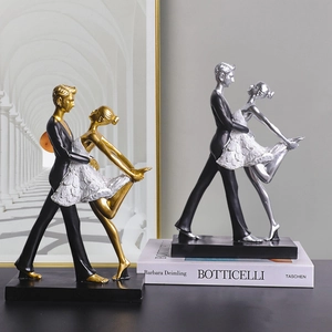 Eleganti sculture di danza da sala in resina oro e argento su base nera solida