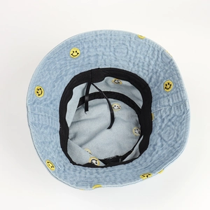 Denim bucket hat with yellow smiley embroidery, interior detail of black sweatband