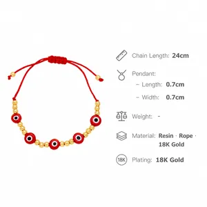 Detail view of red braided bracelet with evil eye charms and 24cm adjustable length