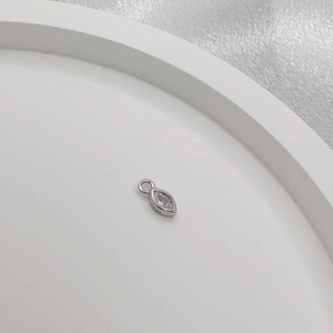 Macro shot of S925 sterling silver marquise pendant with hallmark detail