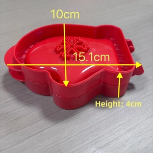 Red 3D Christmas glove cookie cutter with snowflake pattern, measuring 15.1cm by 10cm