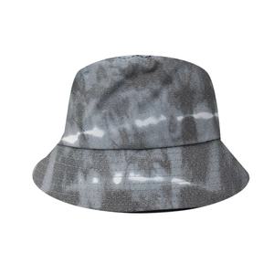 Detailed close-up of thick twill cotton fabric with artistic black and white tie-dye pattern