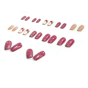 Christmas press-on nails set with red glitter, Santa patterns, and white snowflakes
