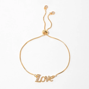 Detail of gold-plated Love heart bracelet featuring box chain and adjustable slider bead