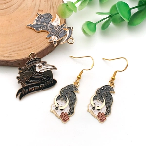 Detail view of Plague Doctor themed enamel jewelry charms with No More Germs engraving