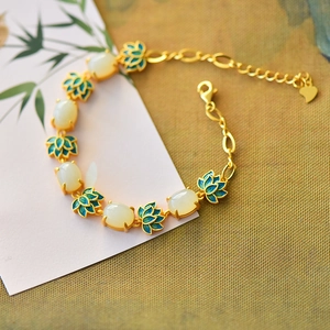 Ancient gold style lotus bracelet with white jade stones and green enamel accents