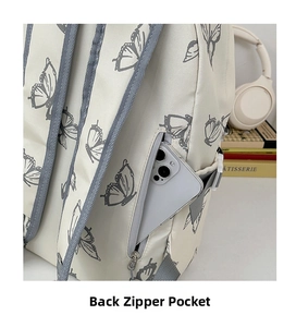 Detail view of the hidden back zipper pocket for anti-theft storage on butterfly backpack