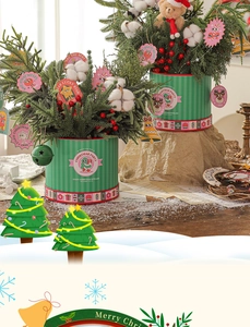 Detailed view of Christmas mini planters with pine branches, red berries and bells