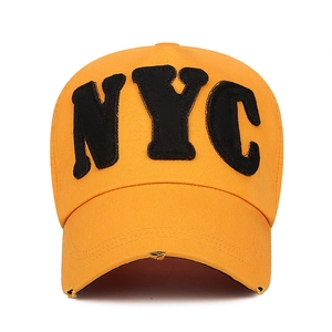 Mustard yellow cotton baseball cap with NYC embroidery and distressed brim detail