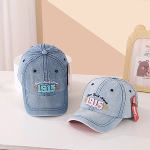 Detail shot of blue denim baseball caps with premium Miami Beach Florida embroidery